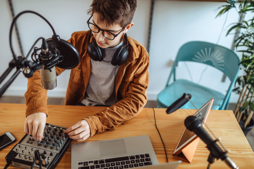 Creative boy setting up studio for radio show